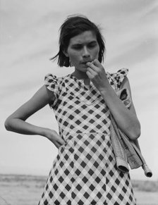 A mother in California who with her family will be returned to Oklahoma by the Relief..., 1937. Creator: Dorothea Lange.