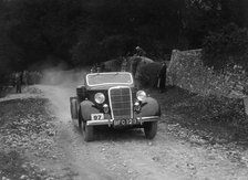 Ford V8 drophead competing in a motoring trial, Nailsworth Ladder, Gloucestershire, 1930s. Artist: Bill Brunell.
