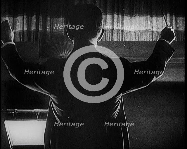 Conductor Starting a Show in London, 1922. Creator: British Pathe Ltd.