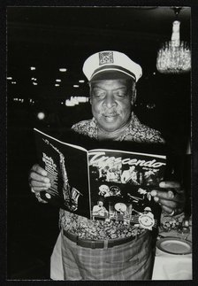 Count Basie reading a copy of Crescendo magazine at the Grosvenor House Hotel, London, 1979. Artist: Denis Williams