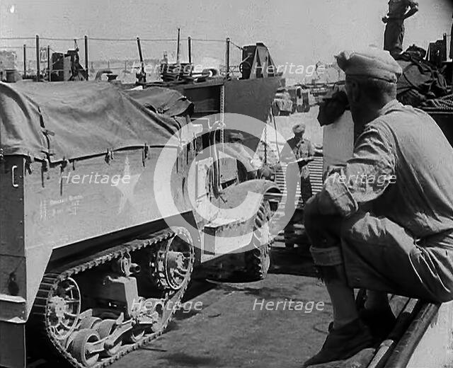 A Supply Truck Backing Into a Supply Depot, 1943. Creator: British Pathe Ltd.