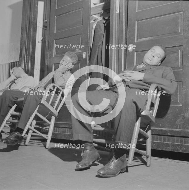 Firemen taking a nap in engine house number four, Washington, D.C, 1943. Creator: Gordon Parks.