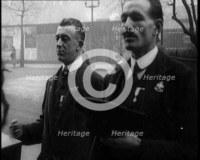Male Ex-Services Civilians Playing a Hurdy-Gurdy For Money in the Street, 1920s. Creator: British Pathe Ltd.