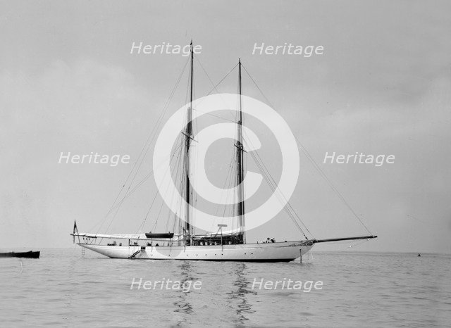 The schooner 'Joyance' at anchor, 1913. Creator: Kirk & Sons of Cowes.