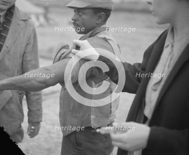 Vaccination in the camp for Negro flood refugees at Marianna, Arkansas, 1937. Creator: Walker Evans.