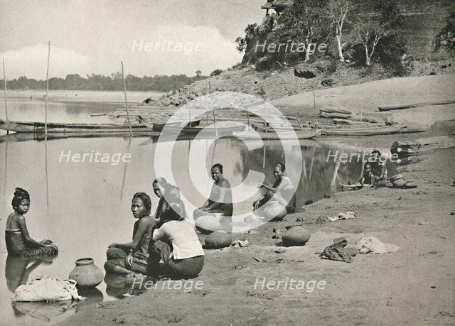'Typical Riverside Scene on the great Irrawaddy - Women bathing and drawing water', 1900. Creator: Unknown.