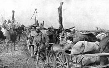 'En territoire libere; Un convoi de ravitaillement sur la route de Doincourt a Roye', 1917. Creator: Unknown.