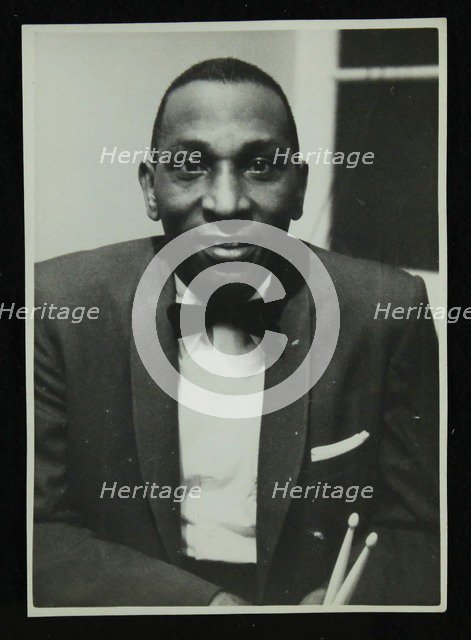 Portrait of American drummer Cozy Cole, 1950s. Artist: Denis Williams