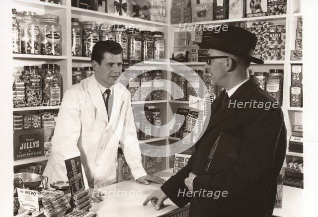 A salesman talking to a shopkeeper, 1956. Artist: Unknown