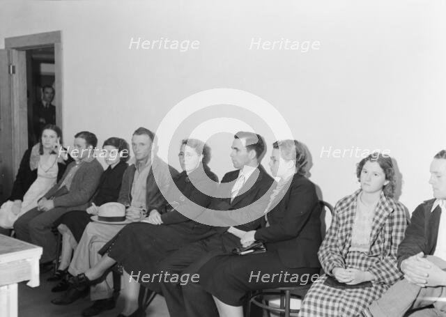 Night meeting in the FSA office, Tulare County, California, 1938. Creator: Dorothea Lange.
