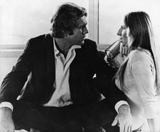 Ryan O’Neal (1941- ), American actor, with Barbra Streisand (1942- ), American actress, 1972. Artist: Unknown