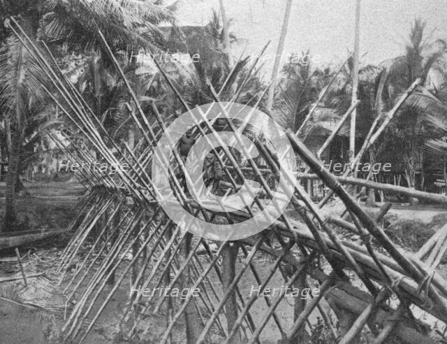 ''Pont jete sur une riviere de la Nouvelle-Guinee britannioue; Les Terres Du Pacifique', 1914. Creator: Unknown.