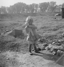 Daughter of a migrant fruit worker, American River camp outside of Sacramento, California, 1936. Creator: Dorothea Lange.