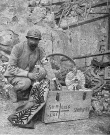 'A travers le champ de bataille; apres notre reoccupation de Breny (Aisne), un pretre..., 1918. Creator: Unknown.