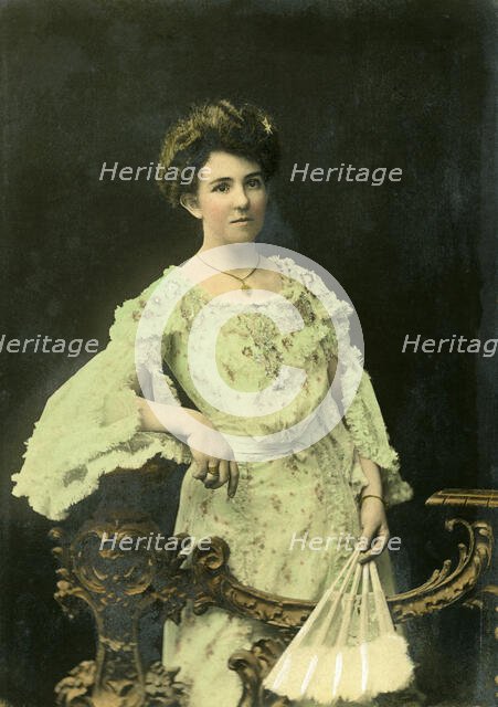 Studio portrait of a lady with fan, 1902. Creator: M Livesey.