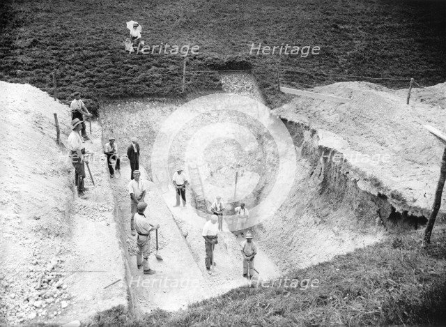 Excavation at Avebury, Wiltshire, 1909. Artist: Harold St George Gray