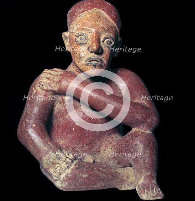 Mexican pottery figure of a squatting man, 4th century. Artist: Unknown