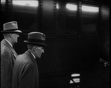 Henry Ford Walking Along a Train Station Platform, 1930s. Creator: British Pathe Ltd.