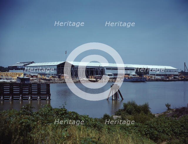 Higgins Industries, Inc., New Orleans, La., makes torpedo boats and other boats for the Navy, 1942. Creator: Howard Hollem.