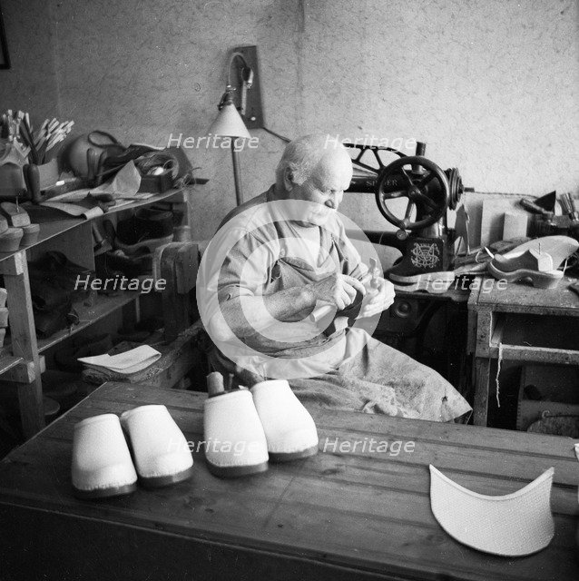 Making wooden clogs, Sweden. Artist: Unknown