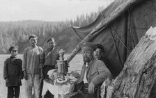 G.I. Ivanov and a Shoria Family at the Table with Samovar Near the Tent, 1913. Creator: GI Ivanov.