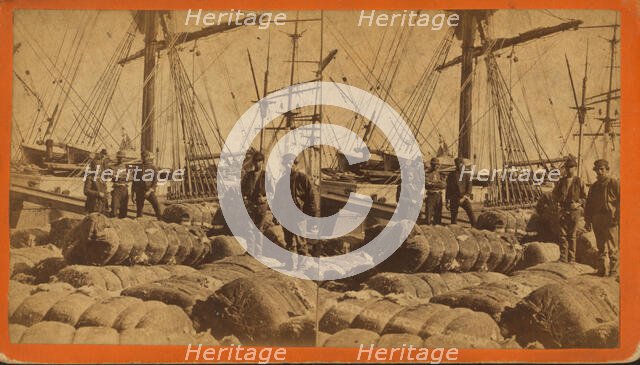 African-American longshore men and bales of cotton on the dock, c1850-c1930. Creator: O. Pierre Havens.