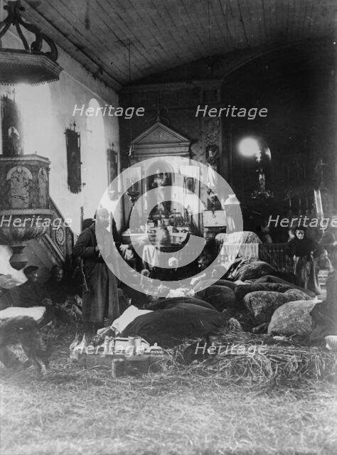 Poor in North France sleeping in church, between 1914 and c1915. Creator: Bain News Service.