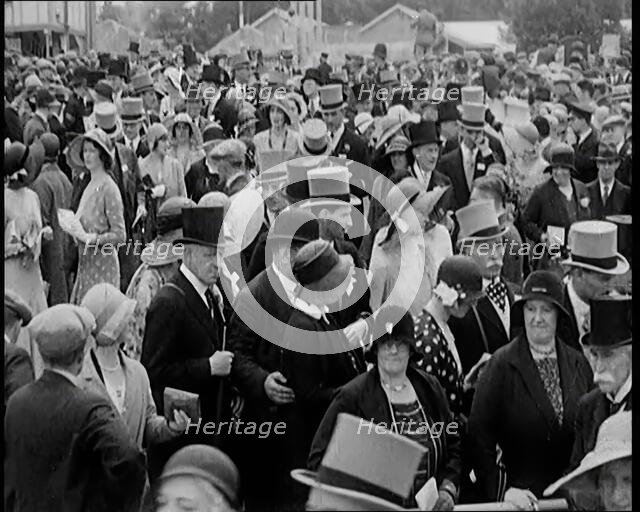 A Large Crowd of Smartly Dressed People in Hats at Ascot Horse Racing Track, 1931. Creator: British Pathe Ltd.