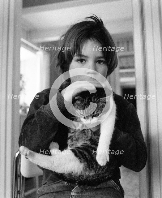 A 5 year old boy with his pet cat. Artist: Unknown