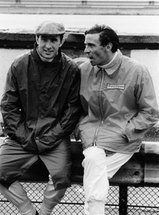 Jackie Stewart on the left, and Jim Clark, 1967. Artist: Unknown