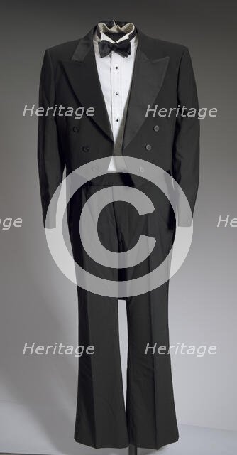 Black tail coat with white pocket handkerchief worn by Cab Calloway, 1976-1995. Creator: After Six.