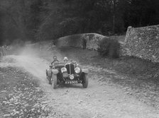 Triumph open tourer competing in a motoring trial, Nailsworth Ladder, Gloucestershire, 1930s.. Artist: Bill Brunell.