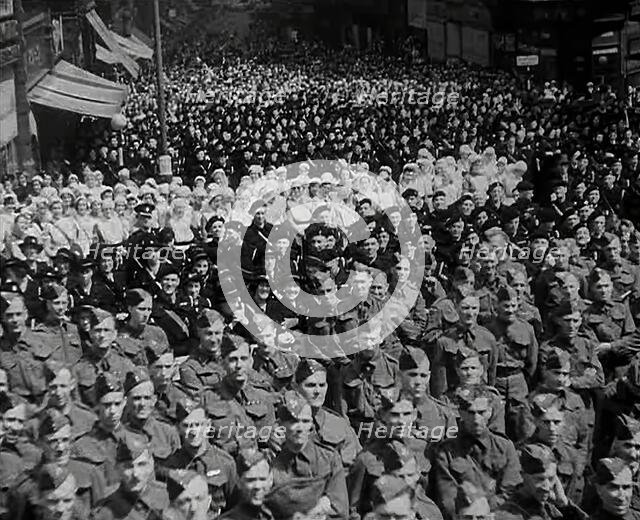 A Crowd of Soldiers Listening to a Speech by Lord Beaverbrook, Birmingham, 1942. Creator: British Pathe Ltd.