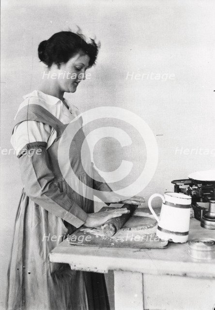 A woman rolls pastry, Rowntree’s factory, York, Yorkshire, 1920. Artist: Unknown