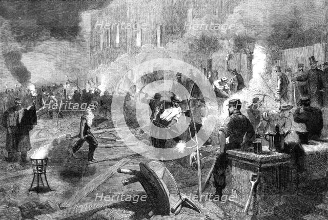 Members of the South Middlesex Rifle Volunteer Corps at work by torchlight in the gardens..., 1862. Creator: Unknown.