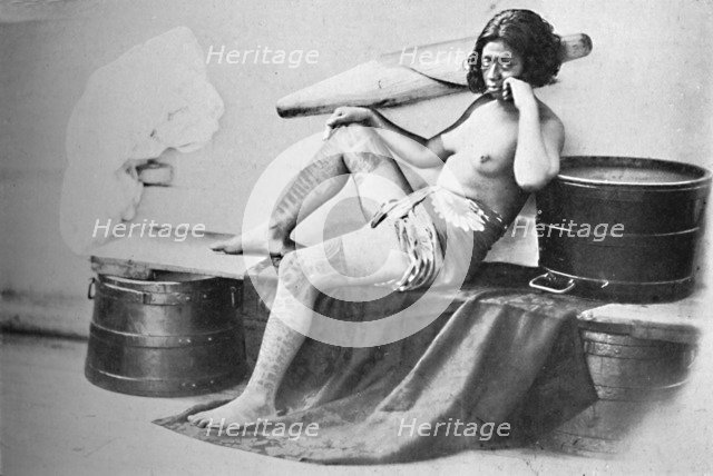 A Marquesa woman with the lower part of the legs fully tattooed, 1902. Artist: Unknown.