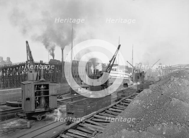 Whirleys unloading ore, Penna. R.R. [Pennsylvania Railroad] docks, Erie, Pa., ca 1900. Creator: William H. Jackson.