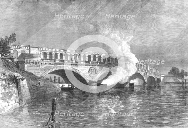 The French Siege of Paris: bridge at the Point du Jour, with gun-boats of the Commune, 1871. Creator: Unknown.