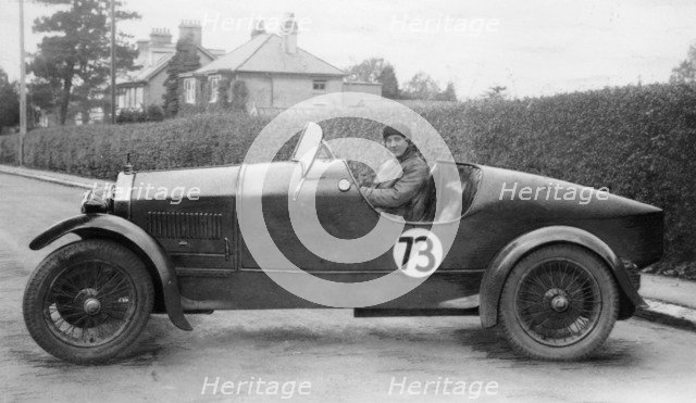 Amy Way seated in a racing car. Artist: Unknown