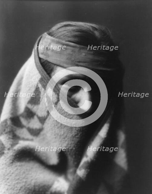 A Navaho [with blanket wrapped around head and shoulders], c1904. Creator: Edward Sheriff Curtis.