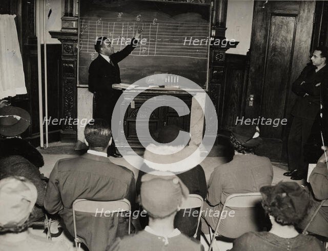 Music class with instructor at the board, 1935 - 1943. Creator: Unknown.