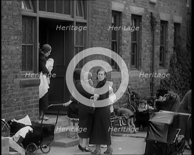 Female Civilians and Their Babies at Health Clinics Where the Babies Are Checked by Female..., 1931. Creator: British Pathe Ltd.