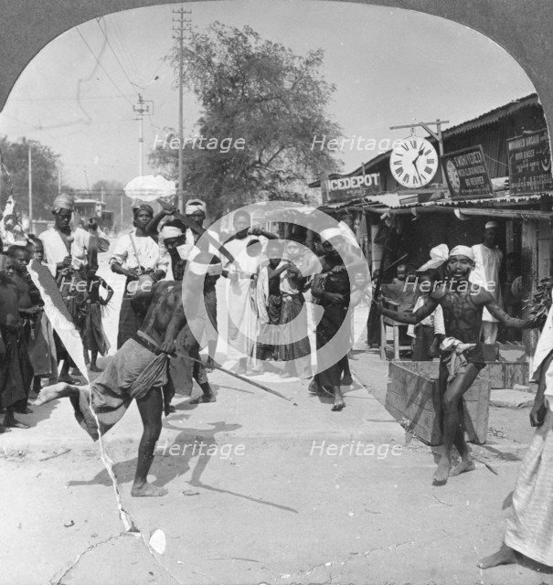 Young men performing a sword dance, Burma, 1908. Artist: Stereo Travel Co
