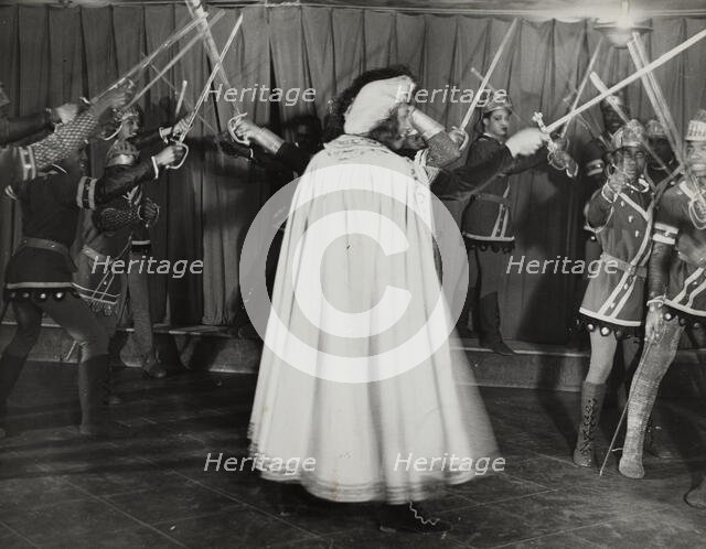 Soldiers with swords raised, 1936. Creator: Eagle Ezzes & Mipaas.