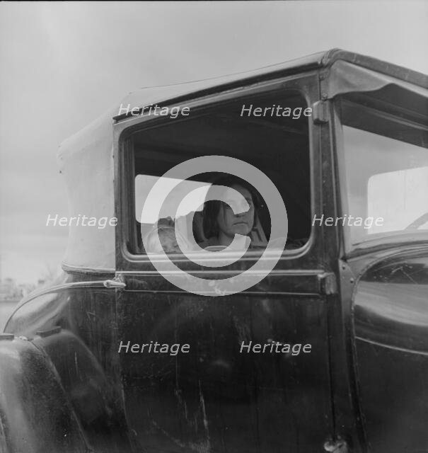 During the cotton strike, a striking picker applies for an emergency food grant, Shafter, CA, 1938. Creator: Dorothea Lange.