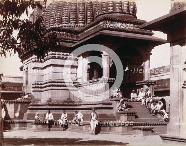 Indian men sitting on steps outside a domed building in Bombay during an outbreak of plague, 1896/7. Creator: Unknown.