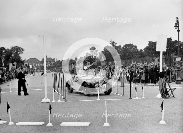Singer B37 1.5 litre sports of DE Harris competing in the South Wales Auto Club Welsh Rally, 1937 Artist: Bill Brunell.
