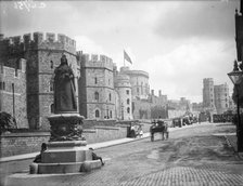 Windsor Castle from Pedscoe Street with a statue of Queen Victoria, Windsor, Berkshire, c1860-c1922. Artist: Henry Taunt