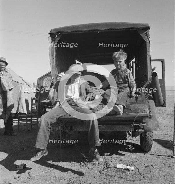 Children of Oklahoma migrants in agricultural workers' camp near Calipatria, California, 1937. Creator: Dorothea Lange.