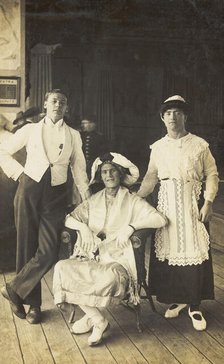 Three soldiers, two in drag, pose in costume, c1920. Creator: Unknown.